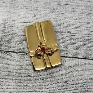 Vintage/retro gold tone gift wrap brooch statement signed